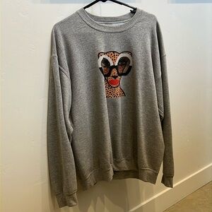 Glasses-wearing cheetah sweatshirt